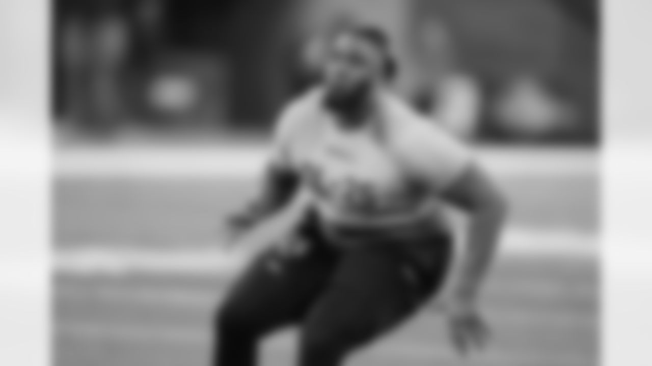 Liberty offensive lineman X'Zauvea Gadlin runs a drill at the NFL football scouting combine, Sunday, March 3, 2024, in Indianapolis. (AP Photo/Darron Cummings)