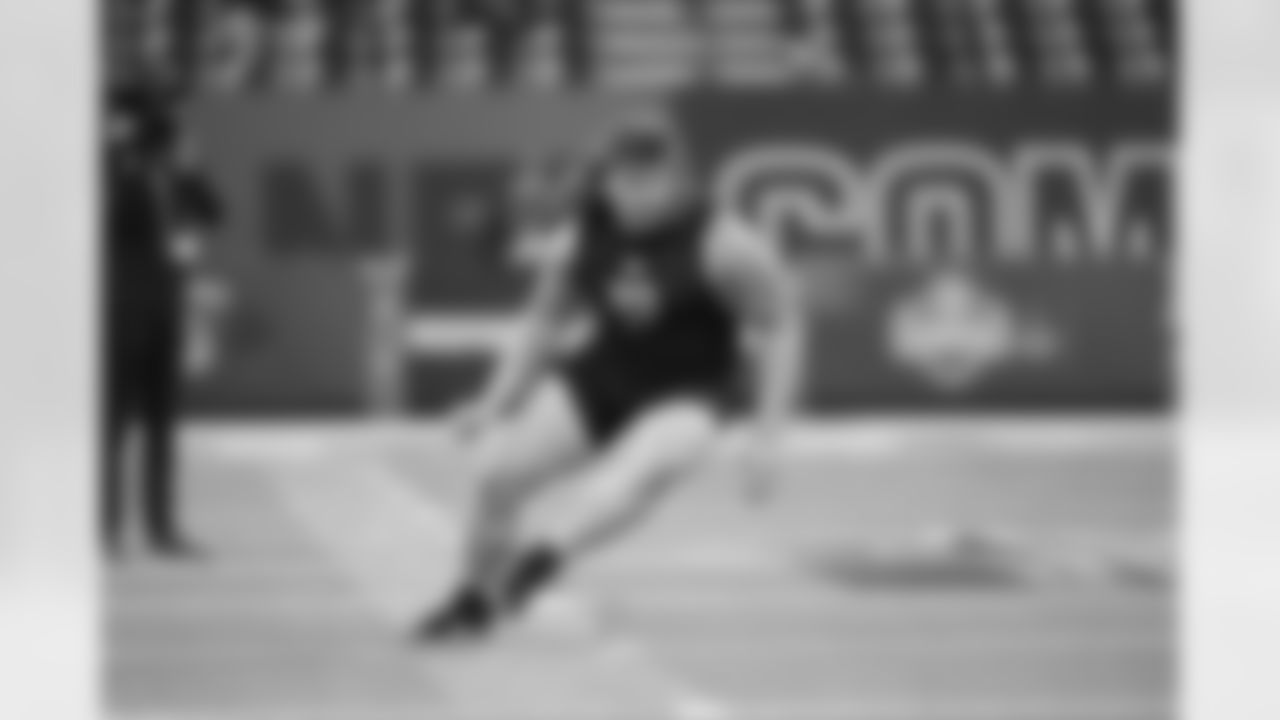 Iowa offensive lineman Gennings Dunker (20) runs a drill at the NFL football scouting combine in Indianapolis, Sunday, March 1, 2026. (AP Photo/Michael Conroy)