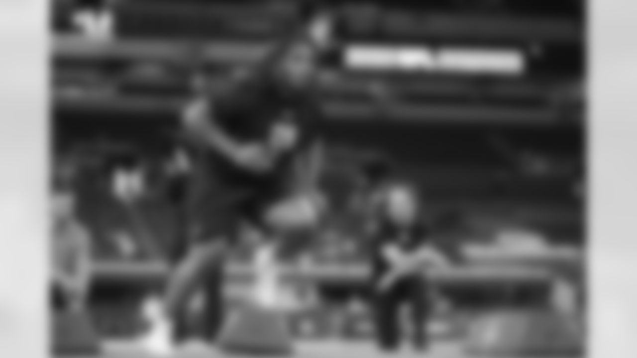 Tennessee defensive lineman Bryson Eason (09) runs a drill at the NFL football scouting combine in Indianapolis, Thursday, Feb. 26, 2026. (AP Photo/Michael Conroy)