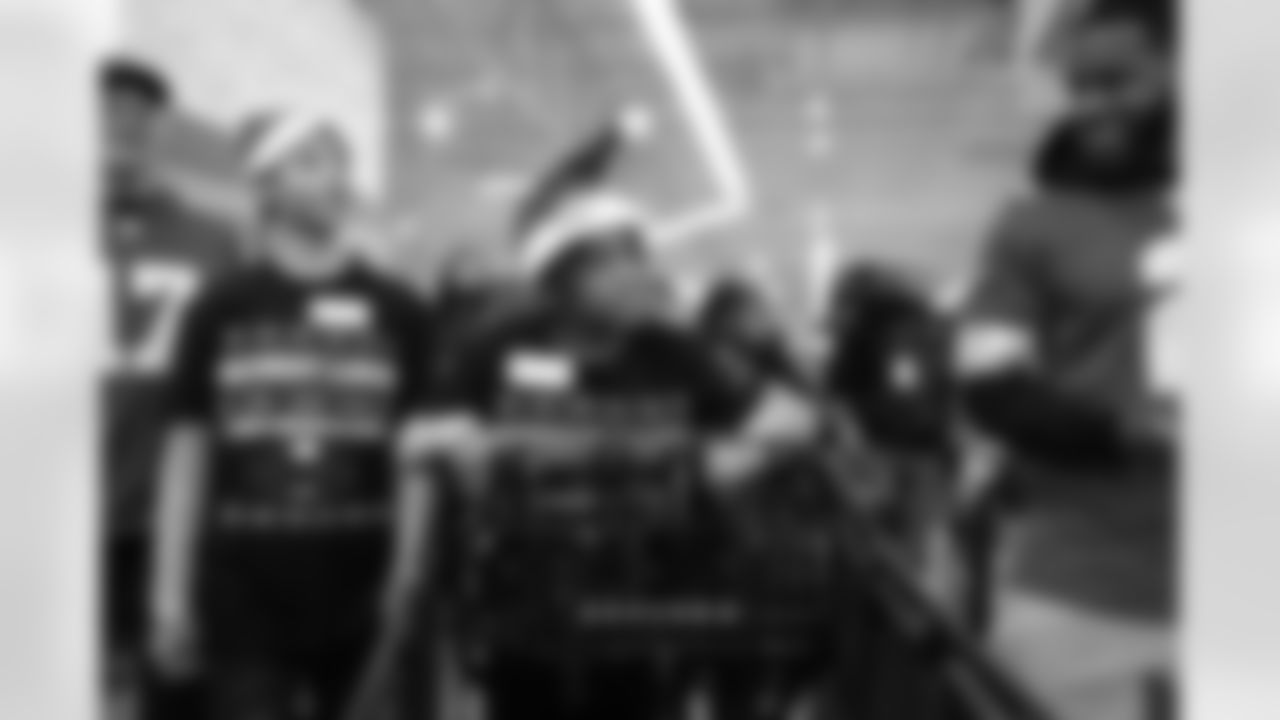 A participant pushing a shopping cart during Shop with a Lion at Meijer on Dec. 8, 2025 in Detroit. (Izzy Rincon/Detroit Lions)