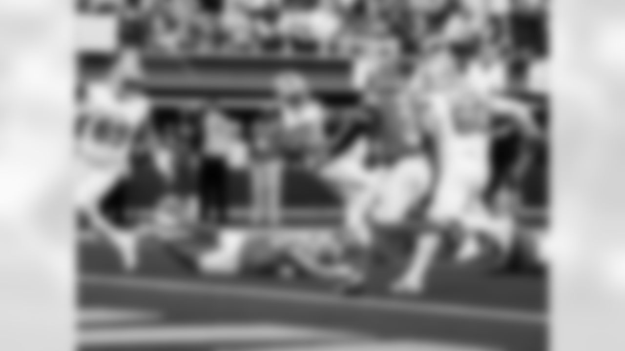 Detroit Lions wide receiver Amon-Ra St. Brown (14) scores a touchdown during an NFL football game against the Los Angeles Rams on Sunday, Dec. 14, 2025 in Inglewood, Calif. (Jeff Nguyen/Detroit Lions via AP)