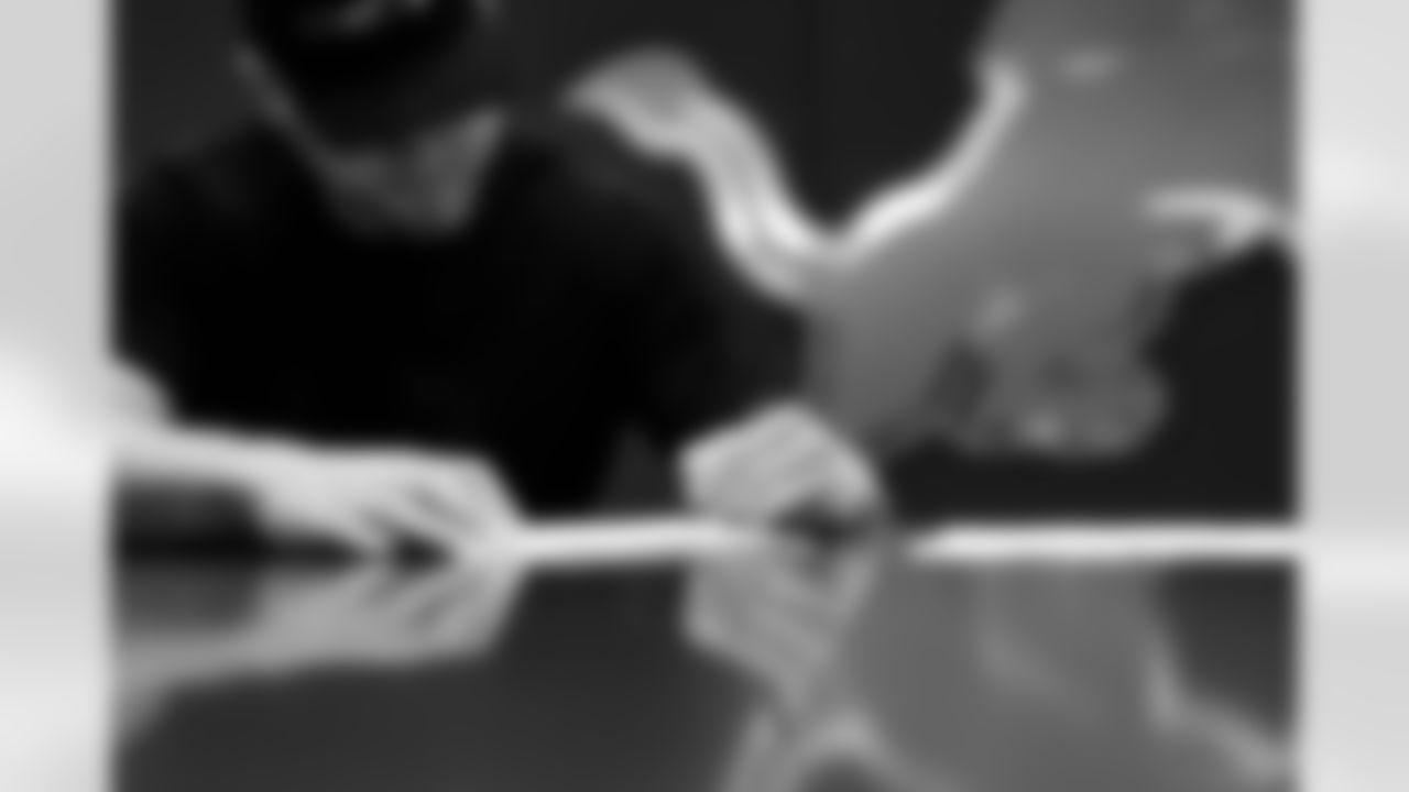 Detroit Lions edge rusher Aidan Hutchinson (97) signs his contract at the Meijer Performance Center on Oct. 29, 2025 in Allen Park, Mich. (Jeff Nguyen/Detroit Lions)