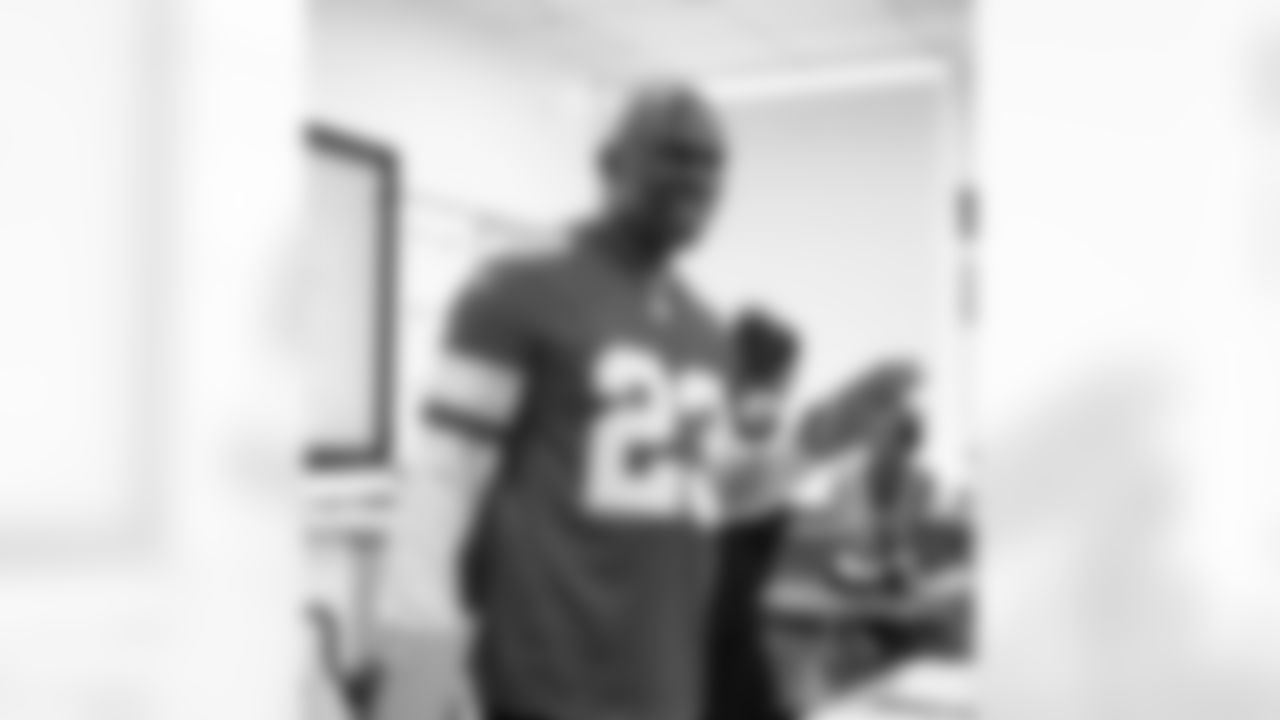 Lions Legend Maurice Harvey (23) smiling while speaking to students during the Presents from the Pride event at Detroit Lions Academy on Dec. 16, 2025 in Detroit. (Izzy Rincon/Detroit Lions)