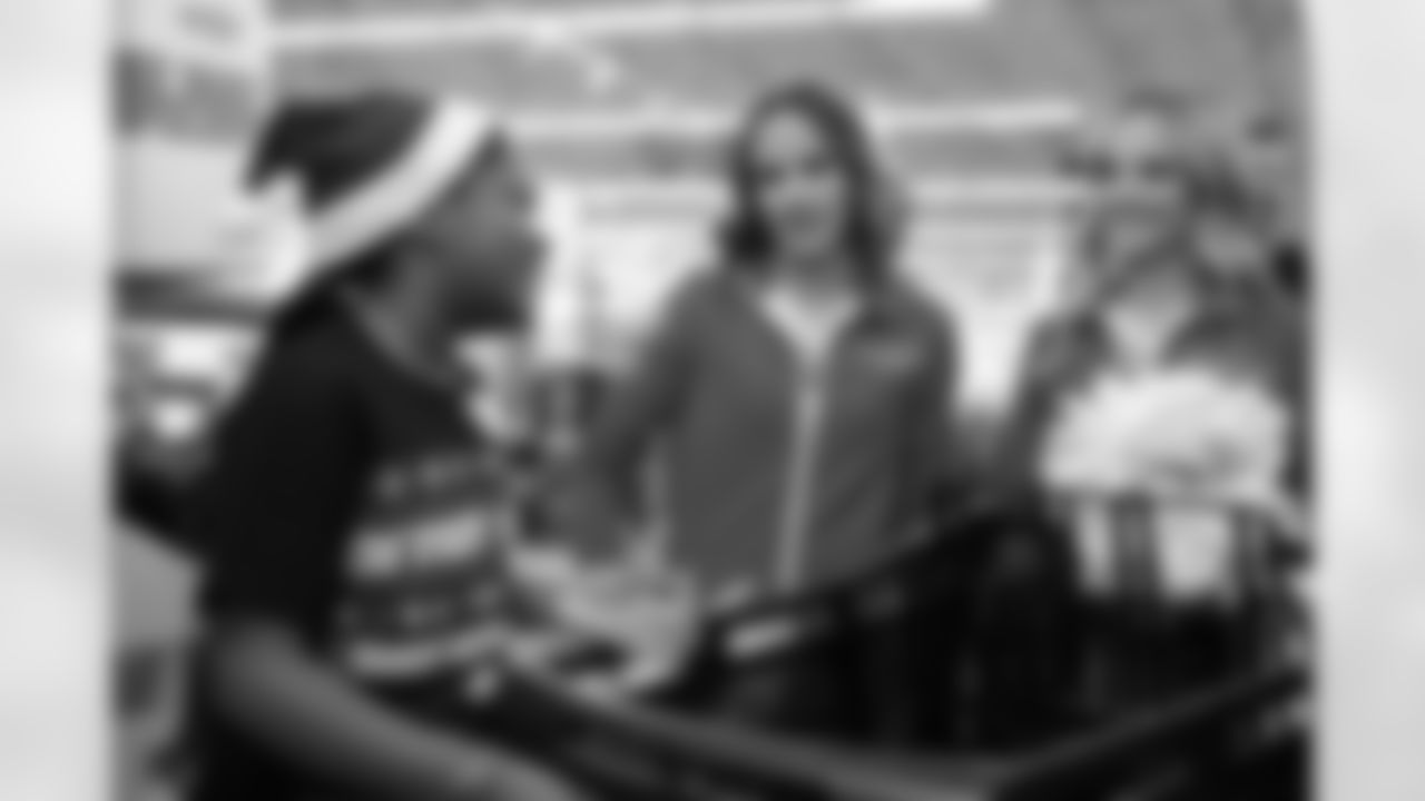 Detroit Lions Cheerleaders talking with a participant during Shop with a Lion at Meijer on Dec. 8, 2025 in Detroit. (Izzy Rincon/Detroit Lions)
