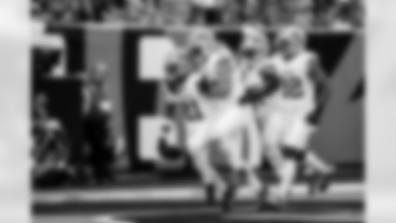 Detroit Lions cornerback Amik Robertson (21) , Detroit Lions linebacker Alex Anzalone (34), Detroit Lions safety Kerby Joseph (31), and Detroit Lions defensive back Brian Branch (32) celebrate after an interception during an NFL football game against the Cincinnati Bengals on Sunday, Oct. 5, 2025 in Cincinnati. (Jeff Nguyen/Detroit Lions via AP)