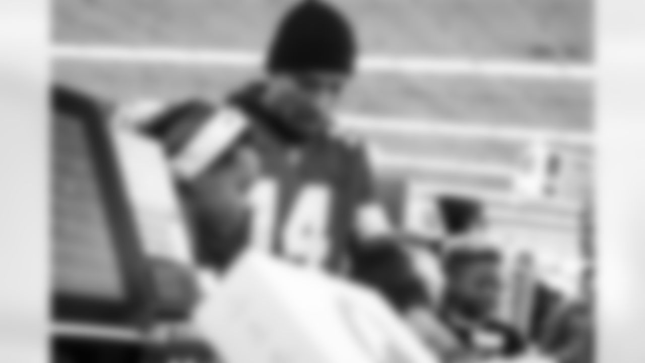 Detroit Lions wide receiver Amon-Ra St. Brown (14) and participants loading items during checkout during Shop with a Lion at Meijer on Dec. 8, 2025 in Detroit. (Izzy Rincon/Detroit Lions)