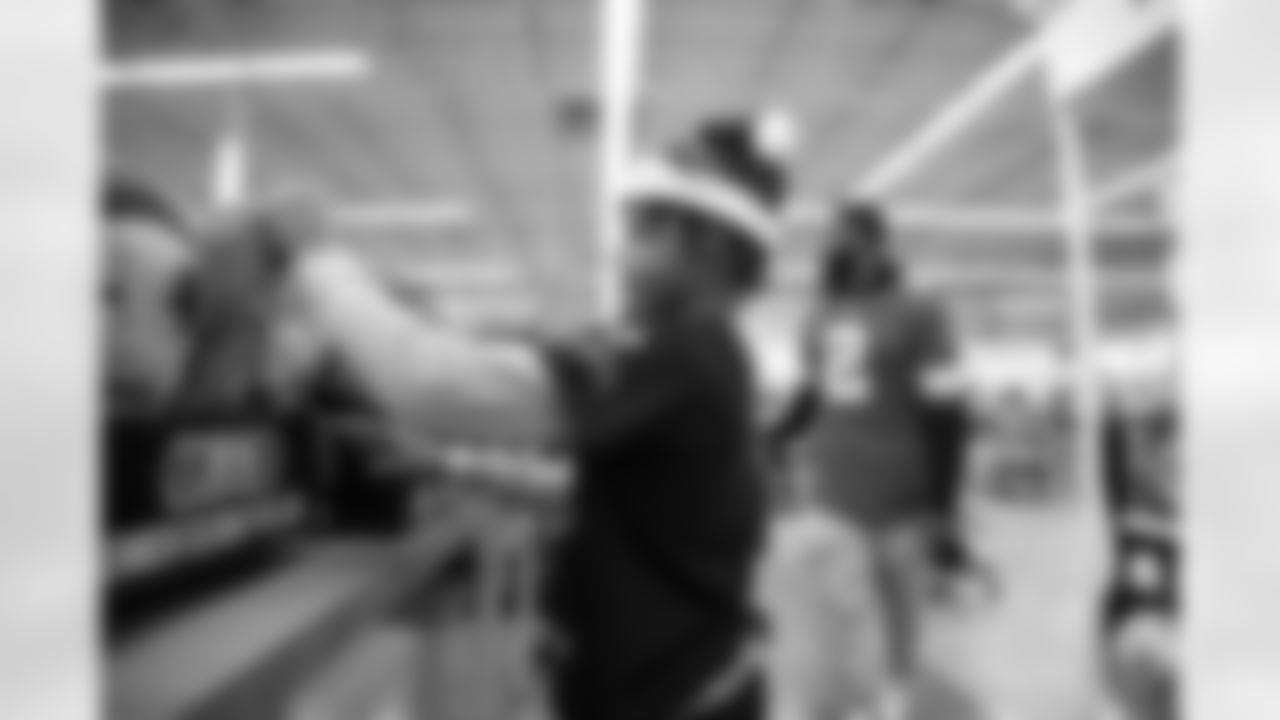 A participant shopping for a Detroit Lions plush during Shop with a Lion at Meijer on Dec. 8, 2025 in Detroit. (Izzy Rincon/Detroit Lions)