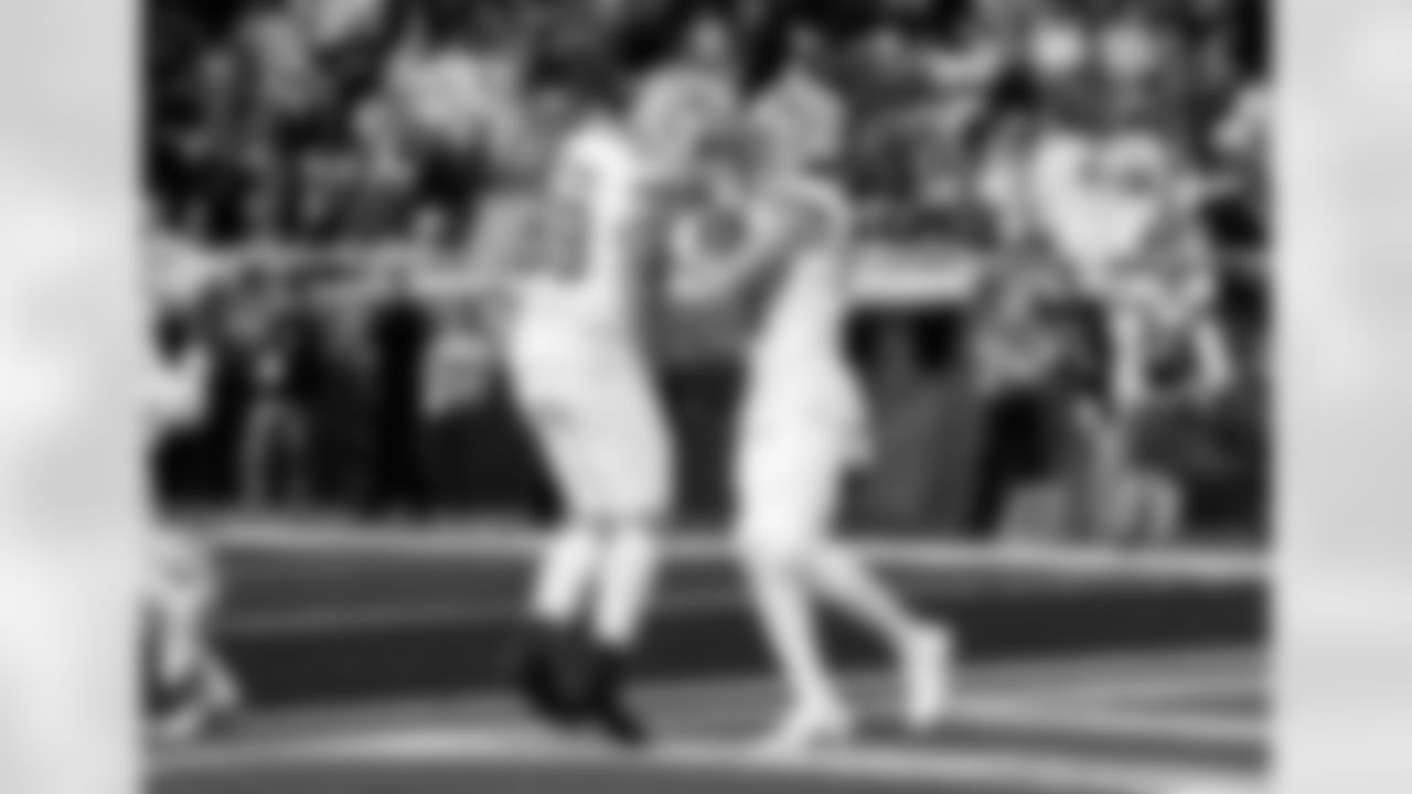 Detroit Lions offensive lineman Tate Ratledge (69) and Detroit Lions wide receiver Isaac TeSlaa (18) celebrate after a touchdown during an NFL football game against the Dallas Cowboys on Thursday, Dec. 4, 2025 in Detroit. (Jeff Nguyen/Detroit Lions via AP)