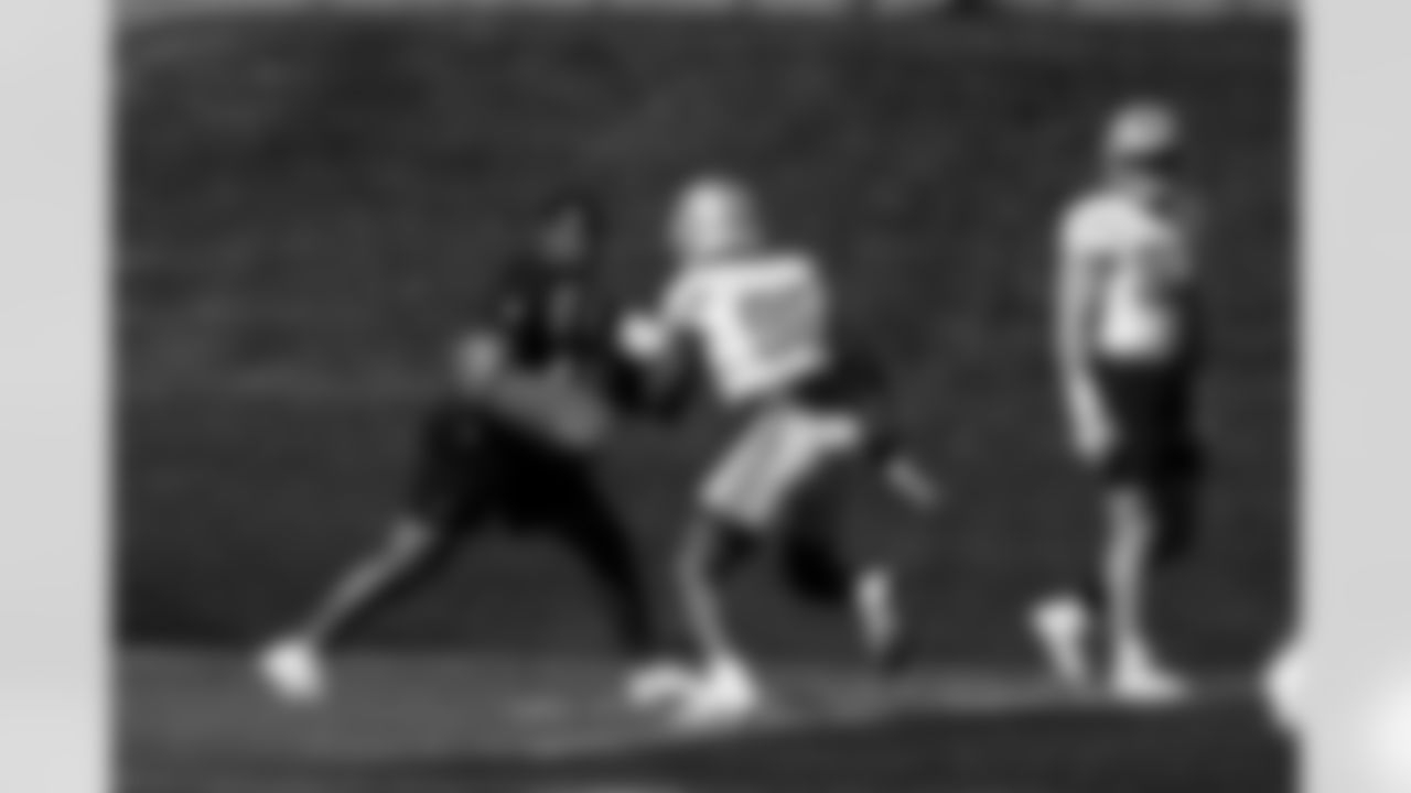 Detroit Lions defensive assistant Caleb Collins and Detroit Lions edge rusher Al-Quadin Muhammad (96) during practice at the Meijer Performance Center on Oct. 9, 2025 in Allen Park, Mich. (Jeff Nguyen/Detroit Lions)