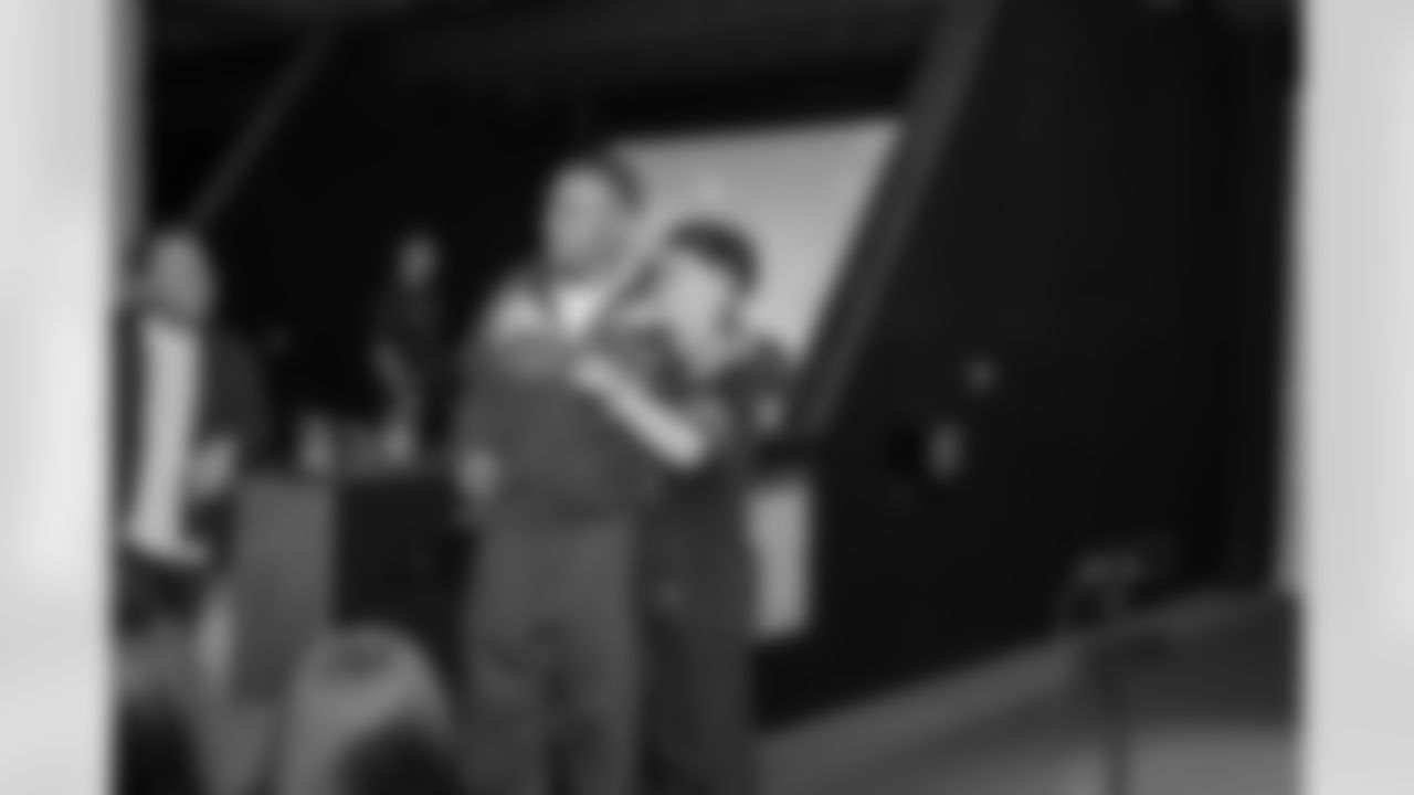 Detroit Lions wide receiver Amon-Ra St. Brown (14) greets guests during a Strike for Literacy event at Five Iron Golf on Nov. 3, 2025 in Detroit.(Carl Jones II/Detroit Lions)