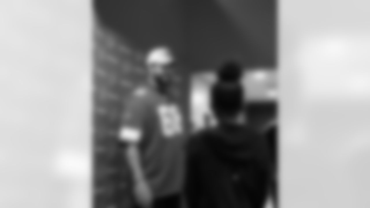 Detroit Lions tackle Taylor Decker (68) smiling during a Thanksgiving lunch event at Alternatives For Girls on Nov. 28, 2025 in Detroit. (Izzy Rincon/Detroit Lions)