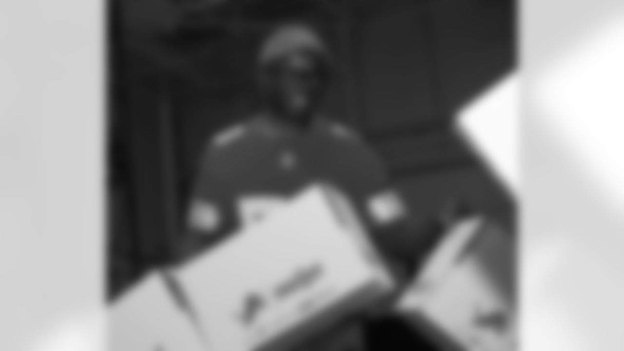 Lions Legend George Jamison (58) smiling during a Thanksgiving meal packing event at Gleaners Community Food Bank on Oct. 14, 2025 in Taylor, Mich. (Izzy Rincon/Detroit Lions)