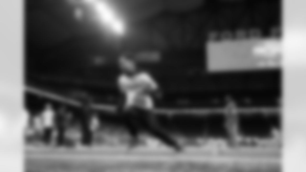 A participant running with a football during the Inspire Change Football Clinic at Ford Field on Dec. 9, 2025 in Detroit. (Izzy Rincon/Detroit Lions)