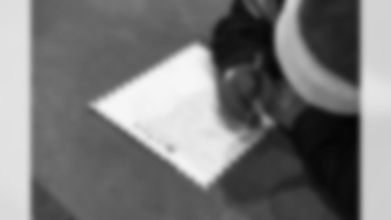 A Cub Club member writes a letter to Santa during the Cub Club Wild Lights event at the Detroit Zoo on Dec. 10, 2025 in Royal Oak, Mich. (Stephanie VanWagoner/Detroit Lions)