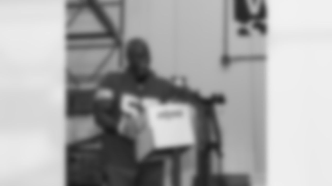 Lions Legend Tim Walton (57) stapling boxes during a Thanksgiving meal packing event at Gleaners Community Food Bank on Oct. 14, 2025 in Taylor, Mich. (Izzy Rincon/Detroit Lions)