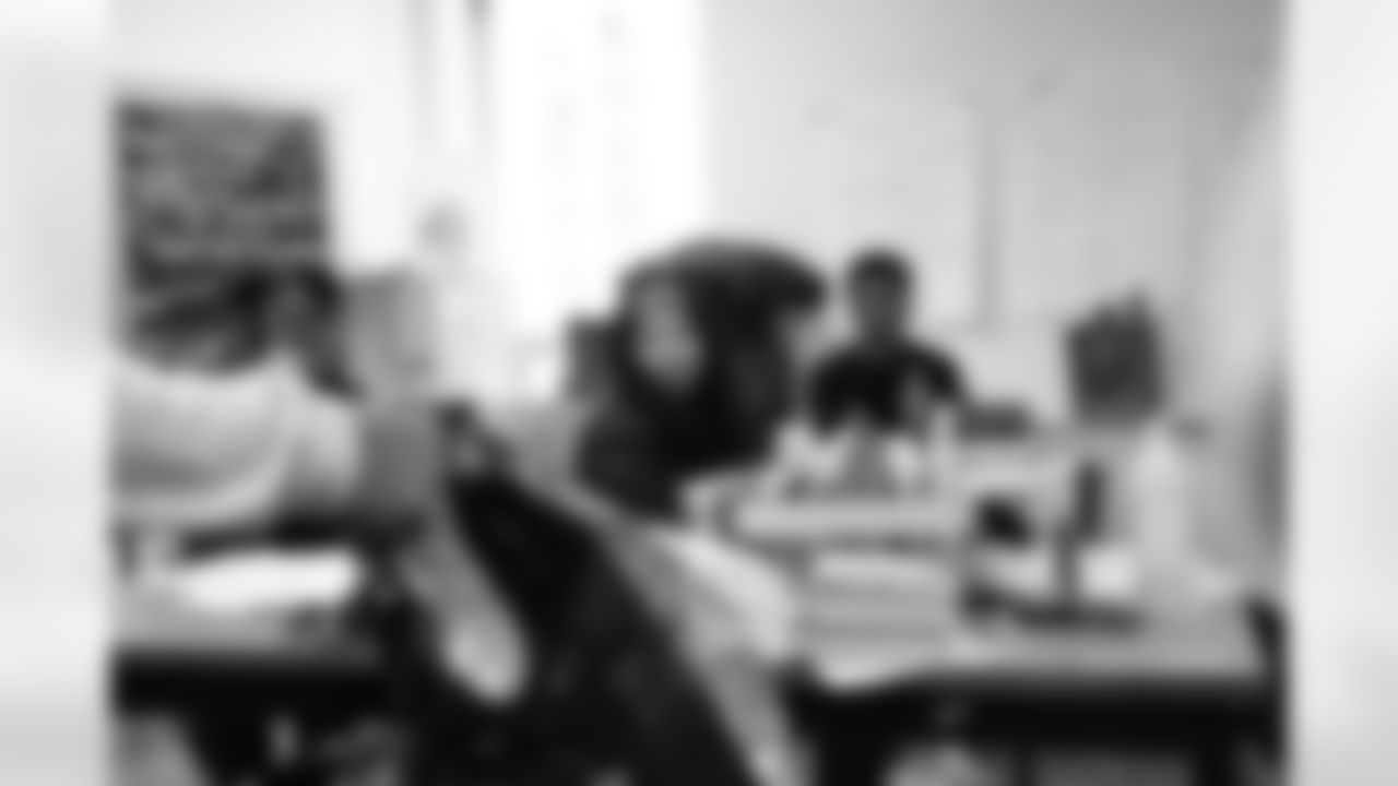 Students receiving presents during the Presents from the Pride event at Detroit Lions Academy on Dec. 16, 2025 in Detroit. (Izzy Rincon/Detroit Lions)