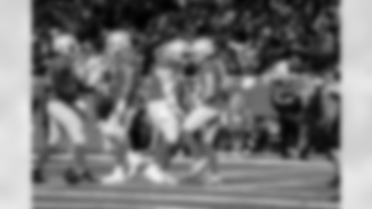 Detroit Lions offensive lineman Trystan Colon (57) and Detroit Lions wide receiver Isaac TeSlaa (18) celebrate after a touchdown during an NFL football game against the Green Bay Packers on Thursday, Nov. 27, 2025 in Detroit. (Jeff Nguyen/Detroit Lions via AP)