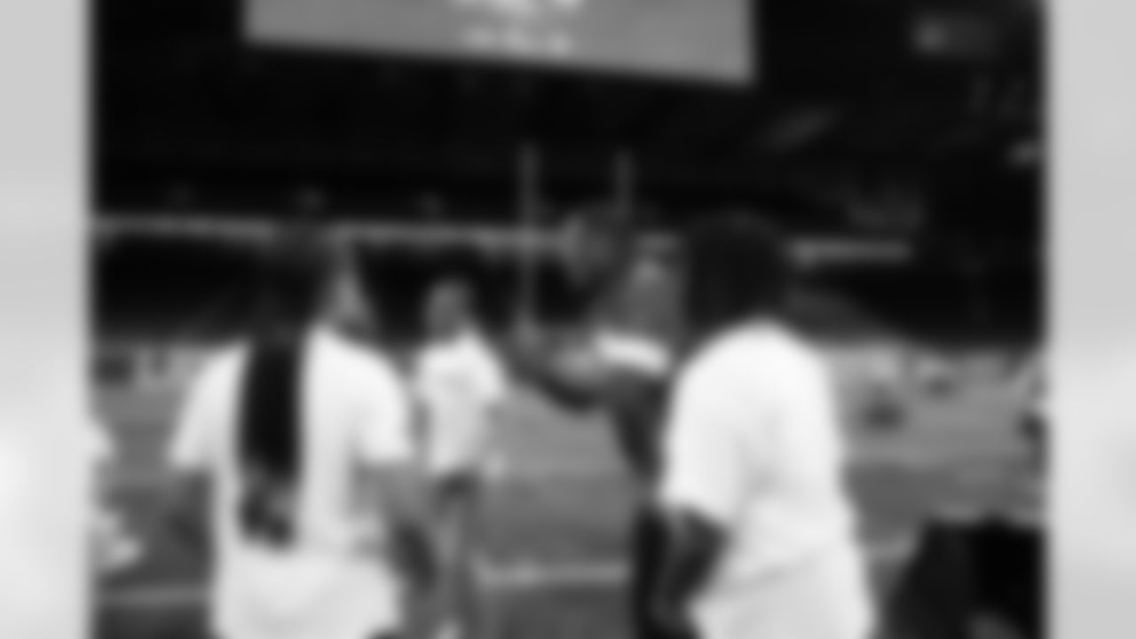 Detroit Lions edge rusher Al-Quadin Muhammad (96) breaking the group down during the Inspire Change Football Clinic at Ford Field on Dec. 9, 2025 in Detroit. (Izzy Rincon/Detroit Lions)