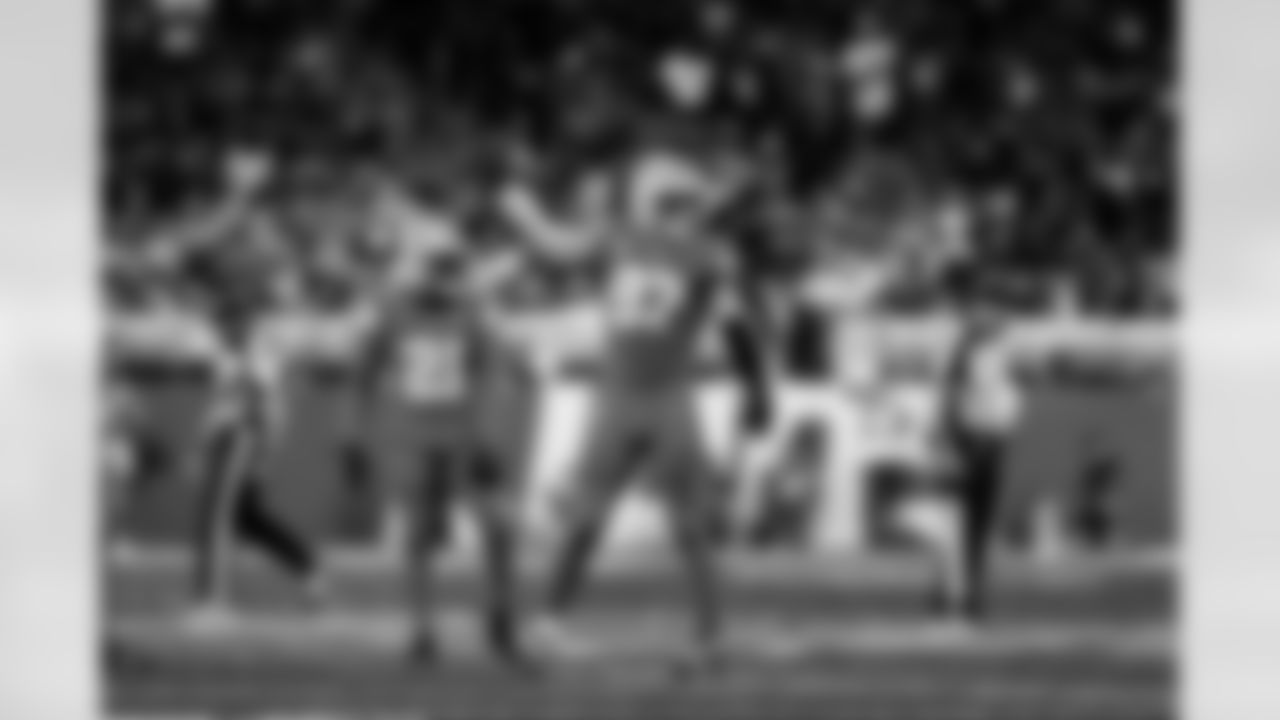 Detroit Lions cornerback Amik Robertson (21) and Detroit Lions edge rusher Aidan Hutchinson (97) during an NFL football game against the Chicago Bears on Sunday, Sept. 14, 2025 in Detroit. (Jeff Nguyen/Detroit Lions via AP)