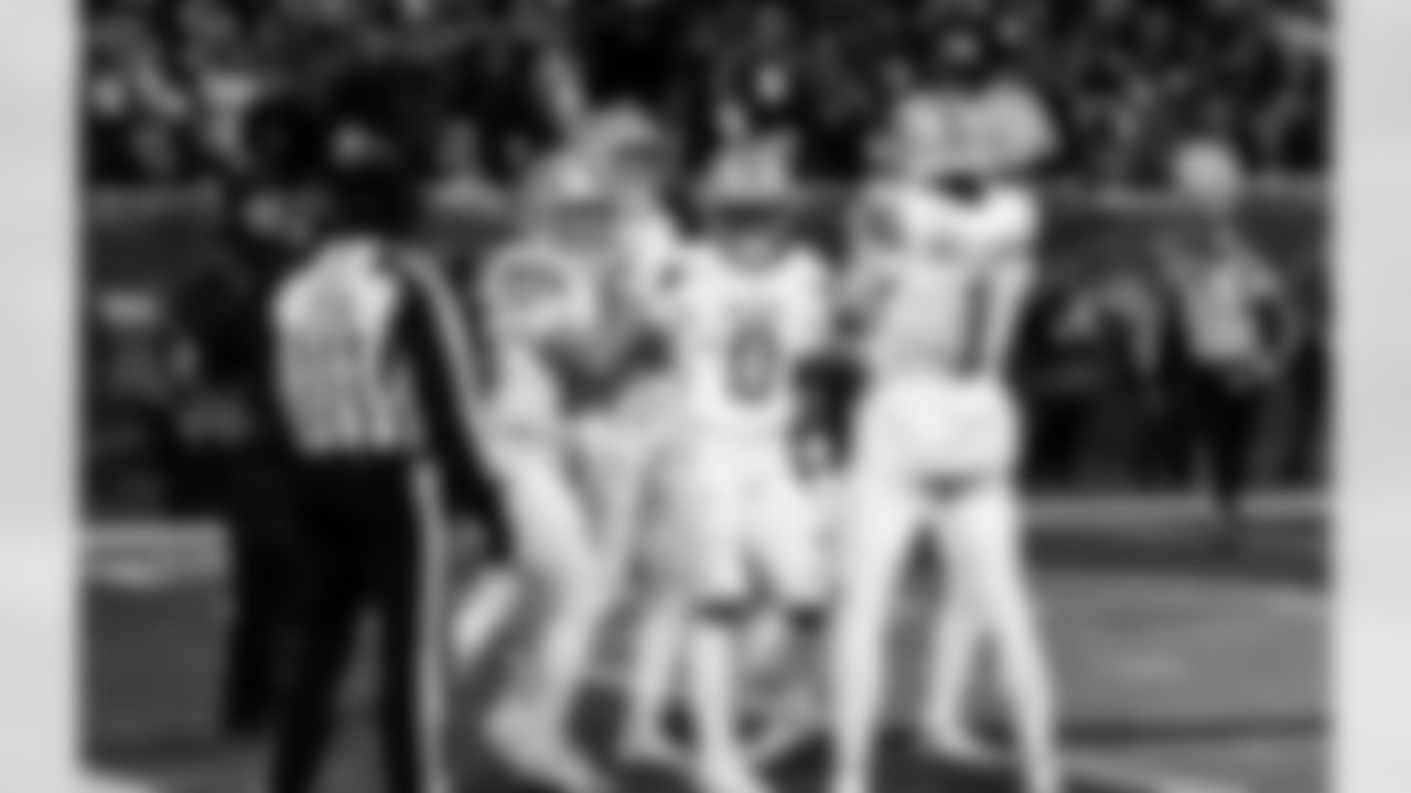 Detroit Lions wide receiver Tom Kennedy (85), Detroit Lions running back Jahmyr Gibbs (0), and Detroit Lions wide receiver Jameson Williams (1) celebrate after a touchdown during an NFL football game against the Chicago Bears on Sunday, Jan. 4, 2026 in Chicago. (Jeff Nguyen/Detroit Lions via AP)