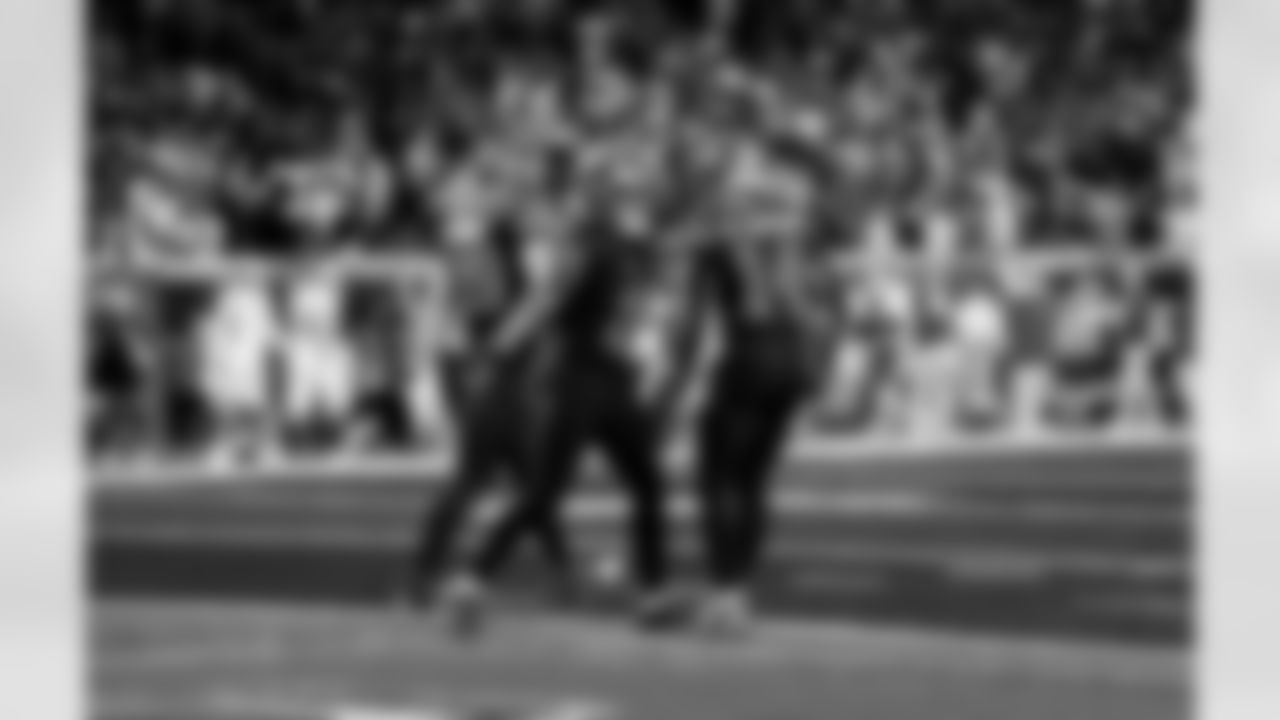 Detroit Lions running back Jahmyr Gibbs (0) and Detroit Lions wide receiver Amon-Ra St. Brown (14) celebrate after a touchdown during an NFL football game against the New York Giants on Sunday, Nov. 23, 2025 in Detroit. (Jeff Nguyen/Detroit Lions via AP)