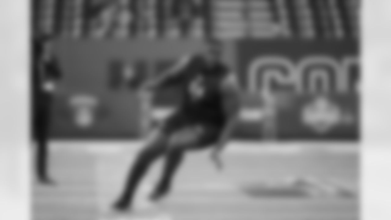 Miami offensive lineman Markel Bell (04) runs a drill at the NFL football scouting combine in Indianapolis, Sunday, March 1, 2026. (AP Photo/Michael Conroy)