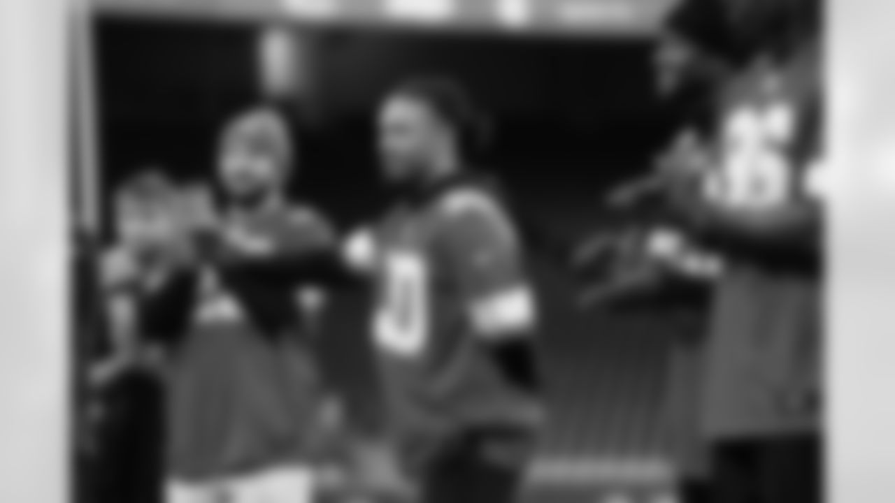 Detroit Lions cornerback Khalil Dorsey (30) waving to participants during the Inspire Change Football Clinic at Ford Field on Dec. 9, 2025 in Detroit. (Izzy Rincon/Detroit Lions)