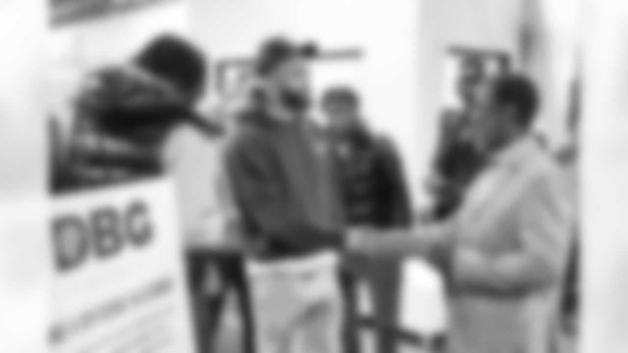 Detroit Lions cornerback Carlton Davis III (23) speaks with Downtown Boxing Gym founder Khali Sweeney at a coat drive event at the Downtown Boxing Gym in Detroit, Michigan on December 10th, 2024. (Troy Anderson/Detroit Lions)