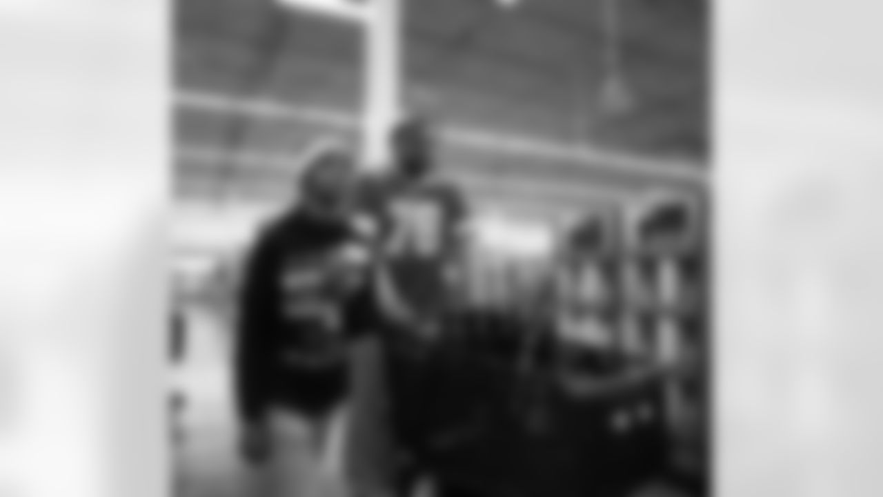 A participant and Detroit Lions defensive lineman Tyler Lacy (78) shopping through the aisles during Shop with a Lion at Meijer on Dec. 8, 2025 in Detroit. (Izzy Rincon/Detroit Lions)