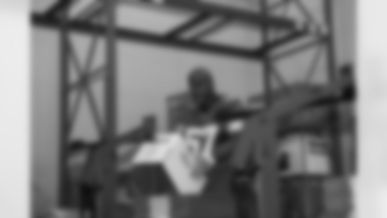 Lions Legend Tim Walton (57) stapling boxes during a Thanksgiving meal packing event at Gleaners Community Food Bank on Oct. 14, 2025 in Taylor, Mich. (Izzy Rincon/Detroit Lions)