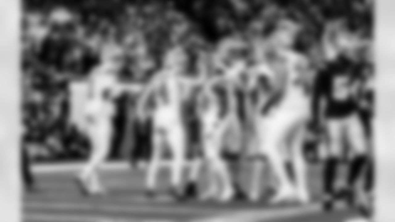 Detroit Lions wide receiver Jameson Williams (1), Detroit Lions wide receiver Amon-Ra St. Brown (14), andDetroit Lions running back Jahmyr Gibbs (0) celebrate after a touchdown during an NFL football game against the Dallas Cowboys on Thursday, Dec. 4, 2025 in Detroit. (Jeff Nguyen/Detroit Lions via AP)