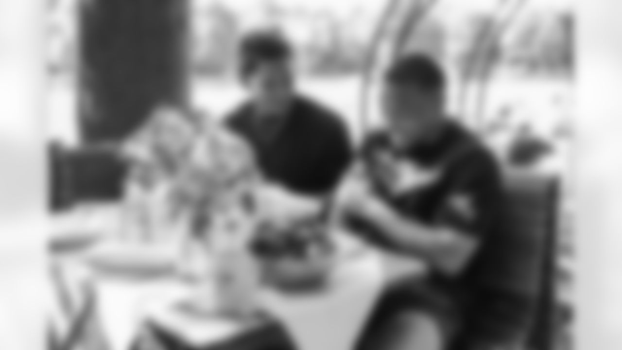 Detroit Lions running back Craig Reynolds (13) and wide receiver Amon-Ra St. Brown (14) eating dinner at Seehaus im Englischen Garten on June 20, 2025 in Munich, Germany. (Stuart Zaas/Detroit Lions)