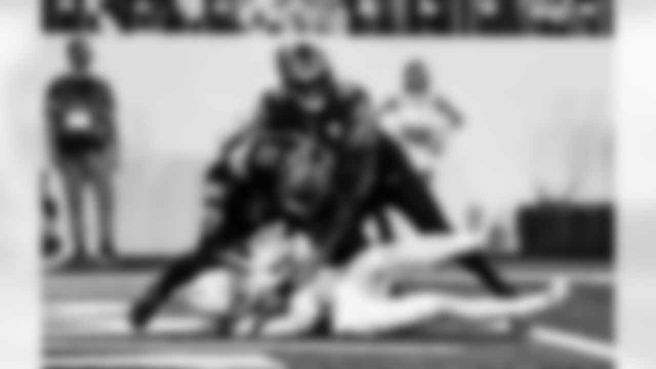 Detroit Lions defensive lineman Roy Lopez (51) and Detroit Lions edge rusher Al-Quadin Muhammad (96) during an NFL football game against the Minnesota Vikings on Thursday, Dec. 25, 2025 in Minneapolis. (Jeff Nguyen/Detroit Lions via AP)