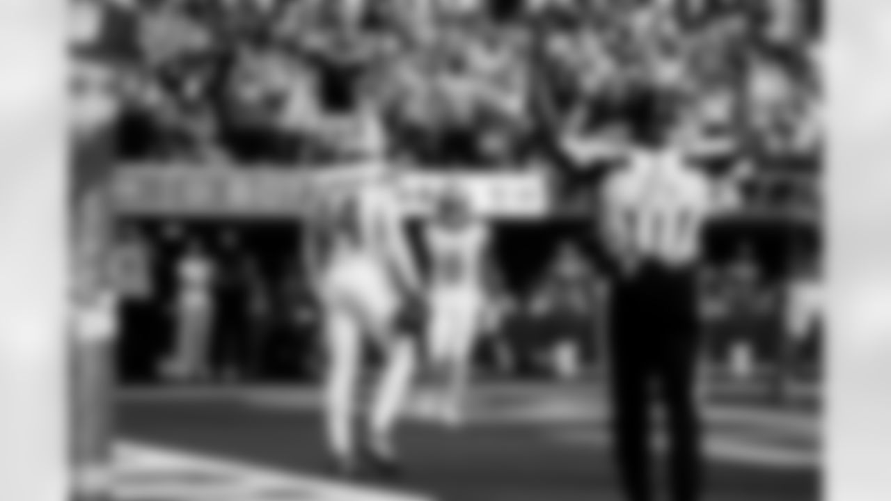 Detroit Lions wide receiver Amon-Ra St. Brown (14) and Detroit Lions running back Jahmyr Gibbs (0) celebrate after a touchdown during an NFL football game against the Los Angeles Rams on Sunday, Dec. 14, 2025 in Inglewood, Calif. (Jeff Nguyen/Detroit Lions via AP)