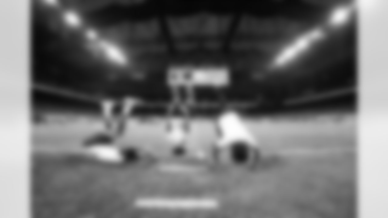 Participants doing headstands during the Inspire Change Football Clinic at Ford Field on Dec. 9, 2025 in Detroit. (Izzy Rincon/Detroit Lions)