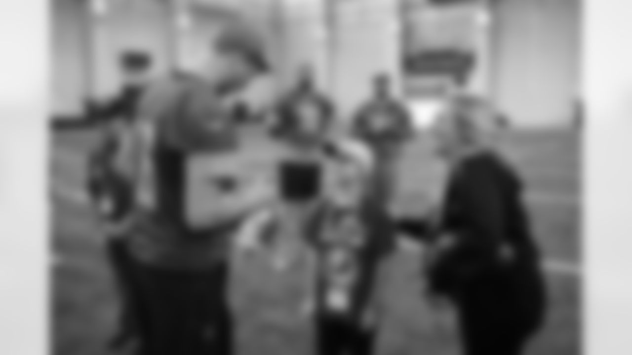TAPS family members of United States Air Force Senior Airman James Hafner III meeting Detroit Lions quarterback Jared Goff (16) during their visit to the Lions training facility in Allen Park, MI on November 18, 2023. (Jeff Nguyen/Detroit Lions)