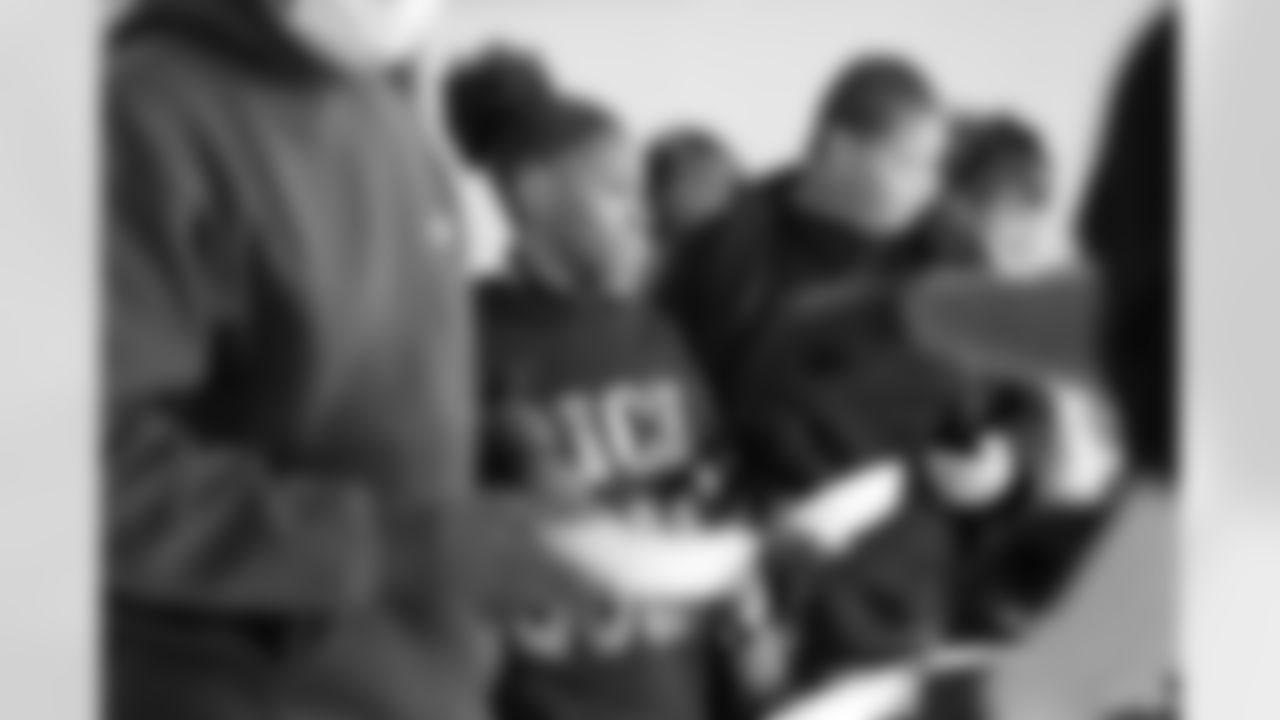 A student getting lunch during the Presents from the Pride event at Detroit Lions Academy on Dec. 16, 2025 in Detroit. (Izzy Rincon/Detroit Lions)