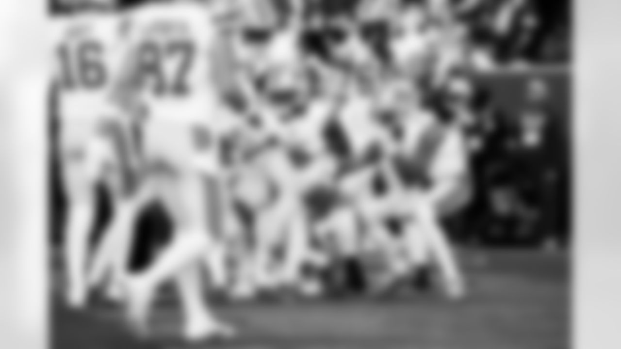 Detroit Lions running back Jahmyr Gibbs (0), Detroit Lions offensive lineman Tate Ratledge (69), and Detroit Lions wide receiver Jameson Williams (1) celebrate after a touchdown during an NFL football game against the Washington Commanders on Sunday, Nov. 9, 2025 in Landover, Md. (Jeff Nguyen/Detroit Lions via AP)
