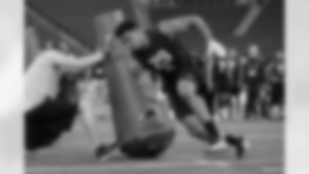 UTSA defensive lineman Marcus Davenport runs a drill at the NFL football scouting combine in Indianapolis, Sunday, March 4, 2018. (AP Photo/Michael Conroy)