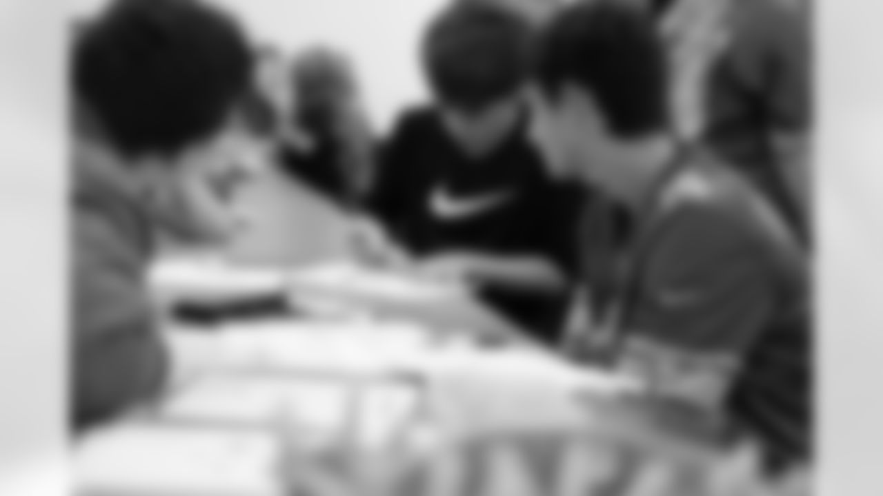 Shoe Club students work on their designs during a shoe design competition event at the Meijer Performance Center on Sept. 27, 2025 in Allen Park, Mich. (Carl Jones II/Detroit Lions via AP)