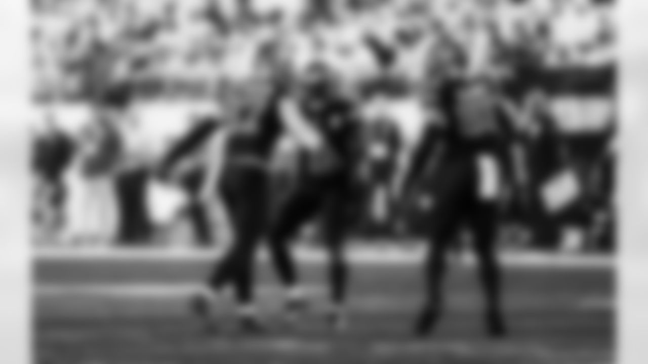 Detroit Lions edge rusher Aidan Hutchinson (97), Detroit Lions safety Daniel Thomas (2), and Detroit Lions linebacker Derrick Barnes (55) celebrate after a sack during an NFL football game against the Minnesota Vikings on Thursday, Dec. 25, 2025 in Minneapolis. (Jeff Nguyen/Detroit Lions via AP)