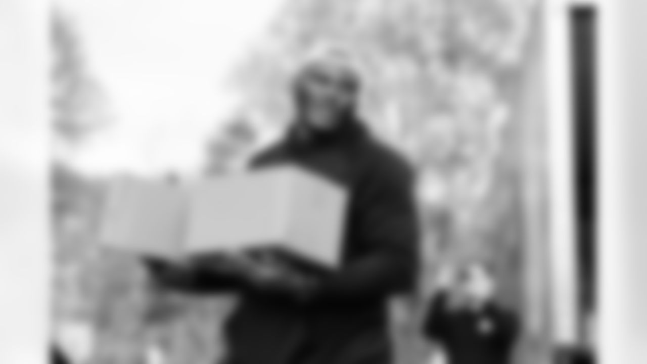 Carolina Panthers defensive end Derrick Brown and Second Harvest Food Bank of Metrolina distribute packages of Thanksgiving food on Tuesday, Nov. 18, 2025 at Hidden Valley Elementary School in Charlotte, NC.