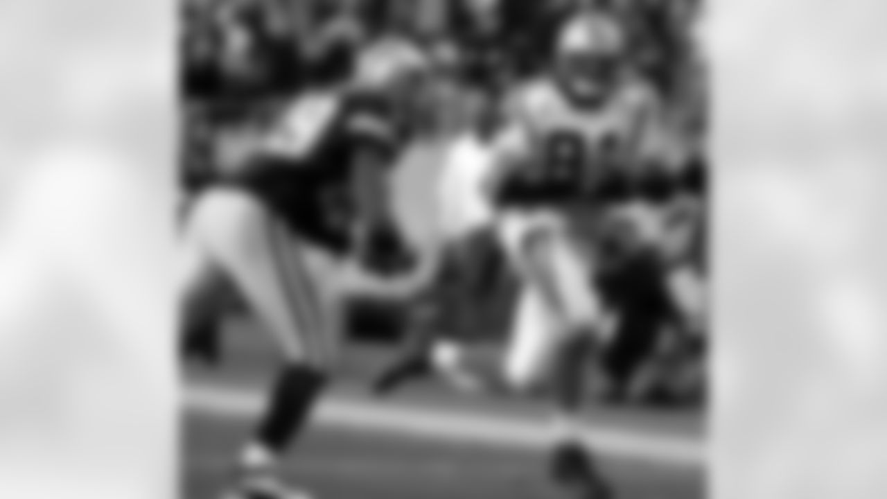 Carolina Panthers' Ricky Proehl (81) runs past Dallas Cowboys' Keith Davis (29) for a touchdown during the fourth quarter of the Cowboys' 24-20 win in their NFL football game in Charlotte, N.C., Saturday Dec. 24, 2005. (AP Photo/Chris Keane)