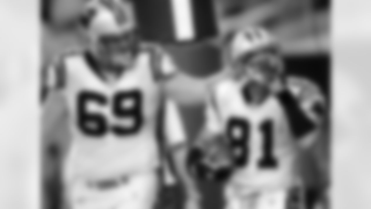 Carolina Panthers wide receiver Ricky Proehl (81) shushes the crowd as he celebrates his game-tying, 3-yard touchdown reception with tackle Jordan Gross in the fourth quarter against the Detroit Lions Sunday, Oct. 16, 2005, in Detroit. The extra point gave the Panthers a 21-20 win. (AP Photo/Duane Burleson)