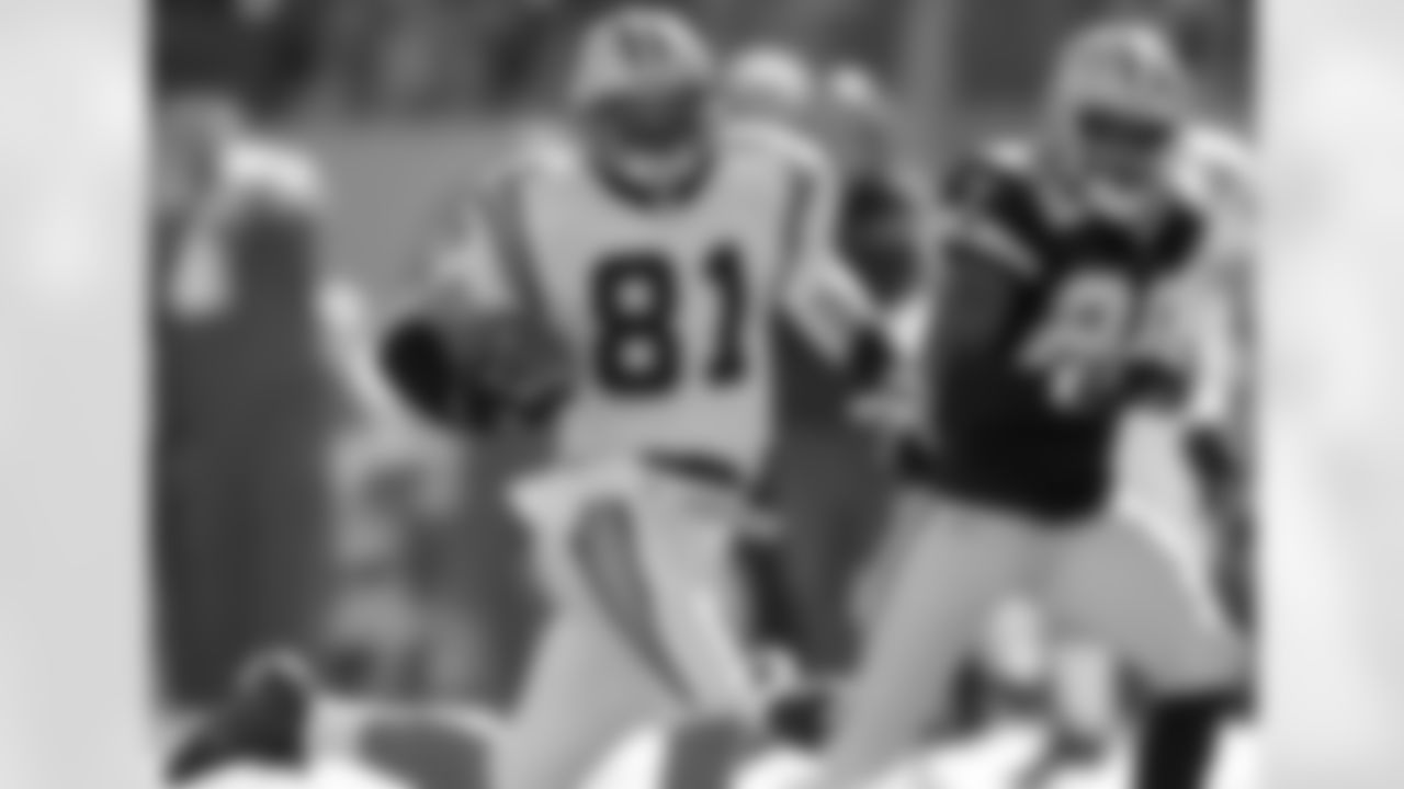 Carolina Panthers' Ricky Proehl (81) runs past Dallas Cowboys' Keith Davis (29) for a 69-yard gain during the first quarter in their NFL football game in Charlotte, N.C., Saturday Dec. 24, 2005. (AP Photo/Chuck Burton)