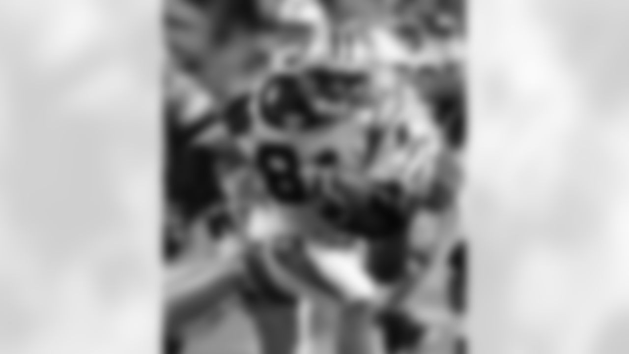 Carolina Panthers receiver Ricky Proehl (81) is pulled down by Detroit Lions cornerback R.W. McQuarters after a 9-yard reception during the fourth quarter in Detroit, Sunday, Oct. 16, 2005. (AP Photo/Carlos Osorio)