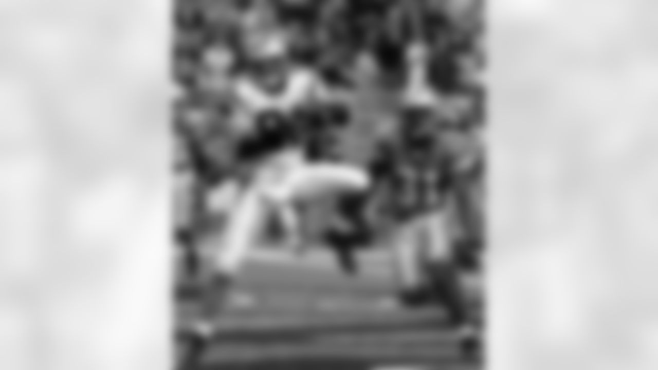 Carolina Panthers receiver Ricky Proehl (81) pulls in a 3-yard touchdown reception in front of Detroit Lions cornerback R.W. McQuarters (31) in the final minute of the game in Detroit, Sunday, Oct. 16, 2005. The Panthers defeated the Lions 21-20. (AP Photo/Carlos Osorio)