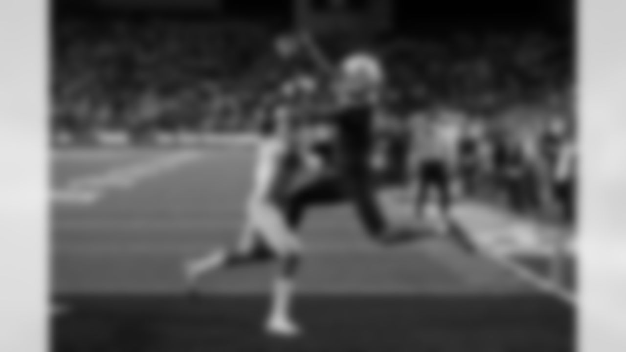 Arizona wide receiver Tetairoa McMillan (4) catches a touchdown pass in front of UCLA defensive back John Humphrey during the second half of an NCAA college football game Saturday, Nov. 4, 2023, in Tucson, Ariz. (AP Photo/Rick Scuteri)