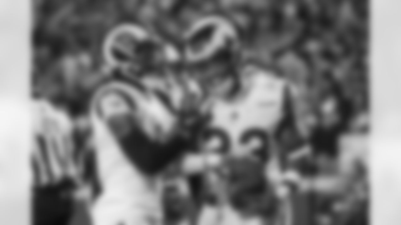 Los Angeles Rams safety Nick Scott (33) celebrates with teammates after making an interception against the Kansas City Chiefs during the second half of an NFL football game, Sunday, Nov. 27, 2022 in Kansas City, Mo. (AP Photo/Reed Hoffmann)