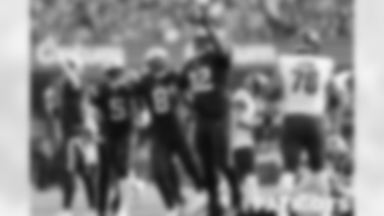 Patriots defensive lineman Davon Godchaux (92), linebacker Ja'Whaun Bentley (8) and defensive back Jabrill Peppers (5).